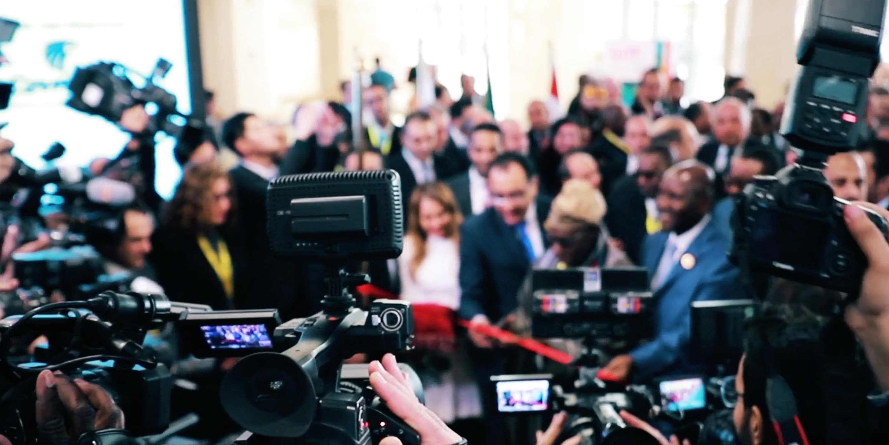 Press cameras surrounding delegates during the official IATF2018 event launch